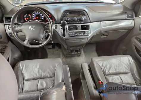 2010 Honda Odyssey Exl z USA, uszkodzony, nr VIN 5FNRL3H63AB090174